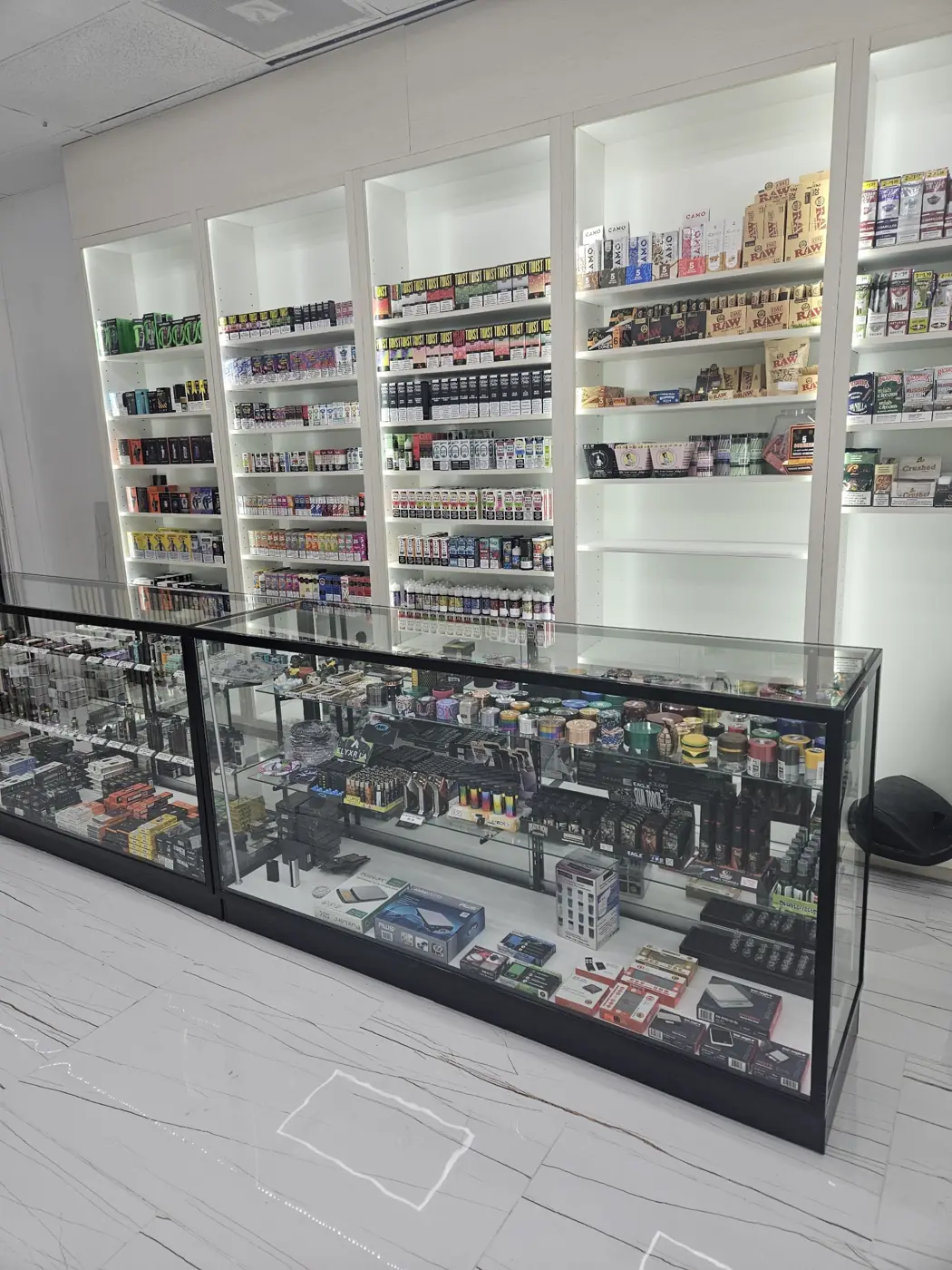 Front counter and vape wall at Huff N Puff Outlaw Vapes