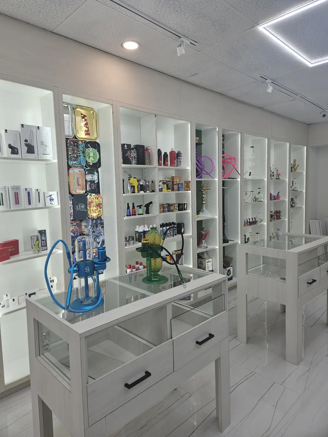 Glass pipes and display tables at Huff N Puff Outlaw Vapes
