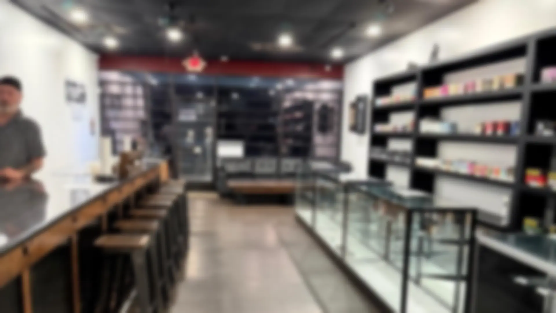 Inside Outlaw Vapes, with the front counter and shelves of e-juice